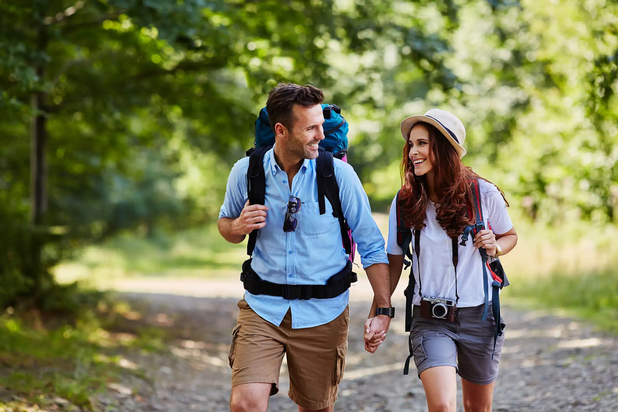 Couple holding hands on a hike